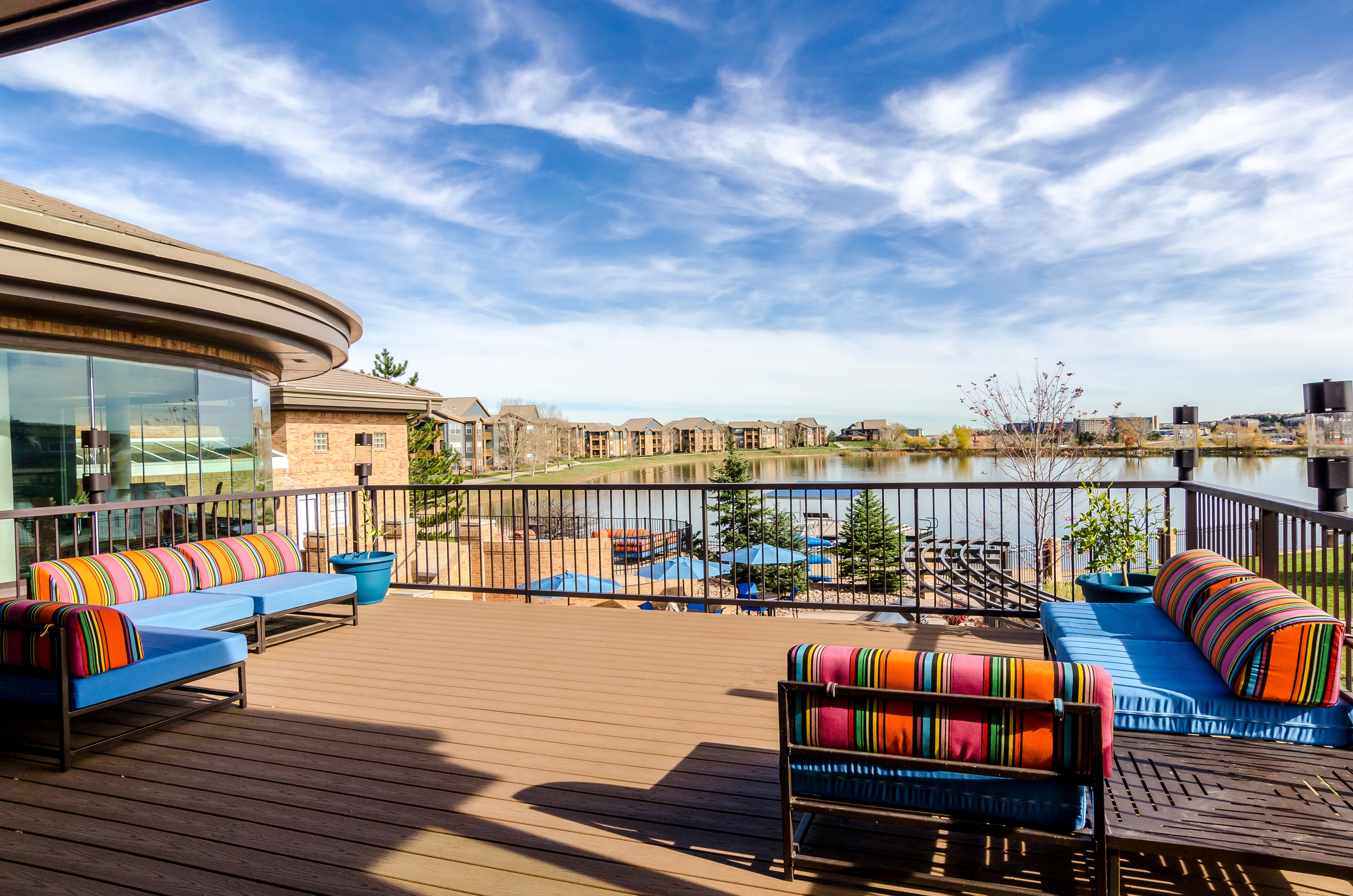 An outdoor seating area overlooking a pond.